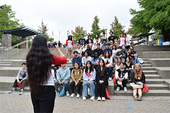 Student taking photo of group of students